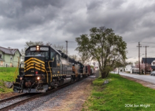 Heavy rains have inundated the region and passing south through Martinsburg, WV along Tuskegee Street is Train 86 on the former Cumberland Valley Railroad after interchanging with Norfolk Southern's Vardo Yard in Hagerstown, MD.