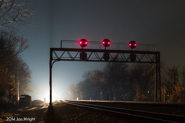 CANNON'S NIGHT LIGHTS: Standing guard on the former Pennsylvania Railroad Pittsburgh Line west of Harrisburg is this signal bridge at Duncannon. An eastbound approaches on track 2 as a westbound, on track 1 awaits to continue on and activates the position light signals.