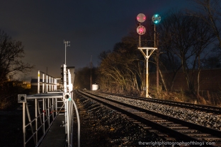 A northbound approaches the N&W signals at Shepherdstown as their replacements lay on the ground ready for installation as part of the PTC mandate.