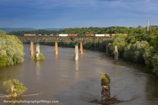 Gliding high across a very swollen Potomac River into Maryland is Norfolk Southern train 16T with the Delaware Lackawanna scheme heritage engine in the lead.